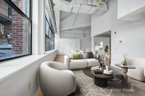 Beautiful living space in four-bedroom loft-style condo for sale in Jersey City.